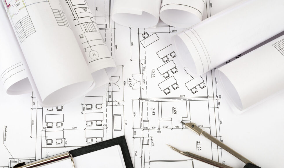 architecture-plan-and-rolls-of-blueprints-2026-01-11-09-28-23-utc